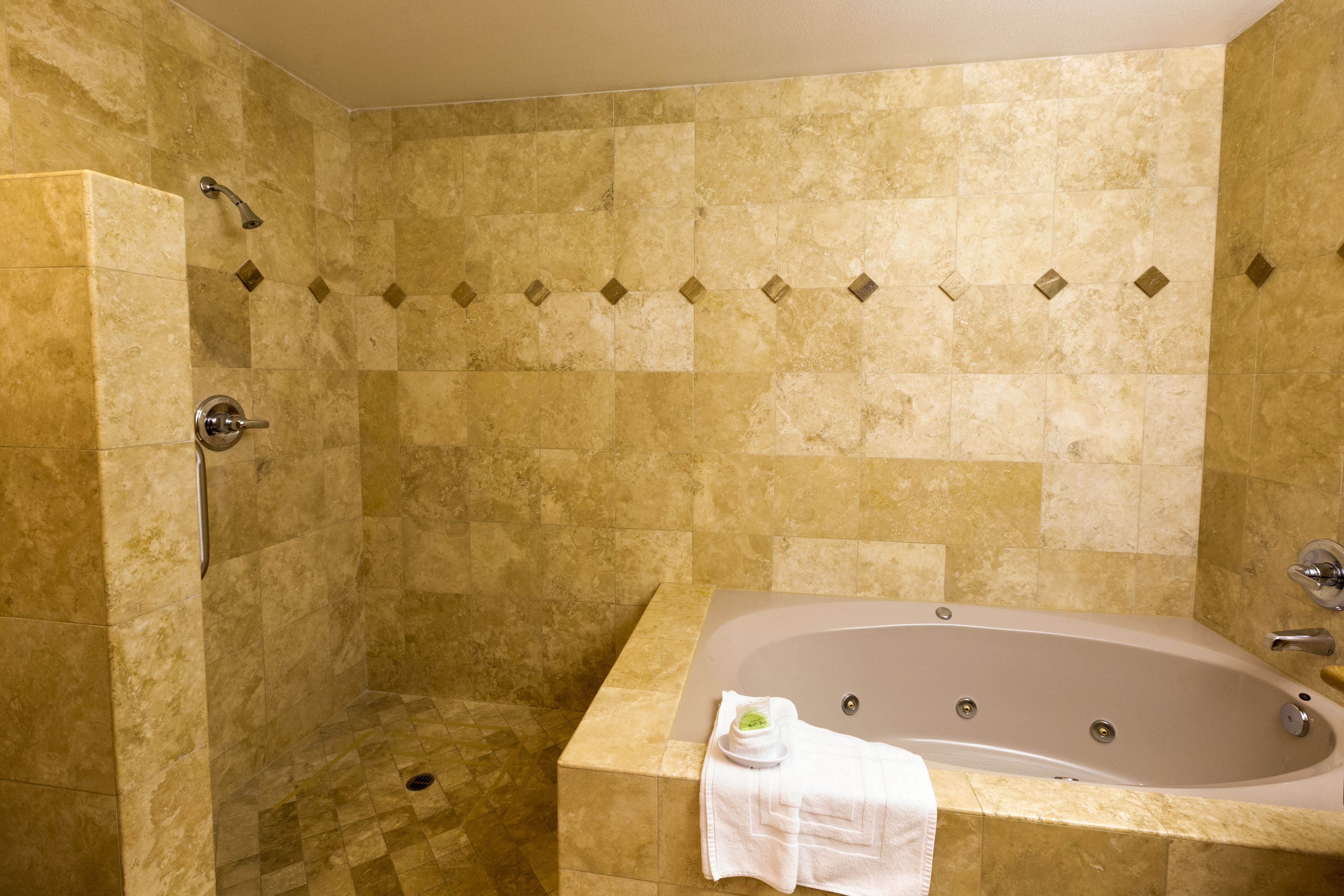 superior room, 1 king bed, balcony, ocean view | bathroom | combined shower/bathtub, hydromassage showerhead, hair dryer, towels
