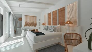 A modern bedroom with a large bed, a sitting area with a chair, and a television.
