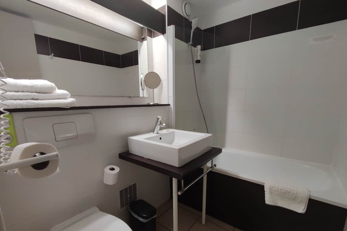 Separate bathtub and shower, free toiletries, hair dryer, towels