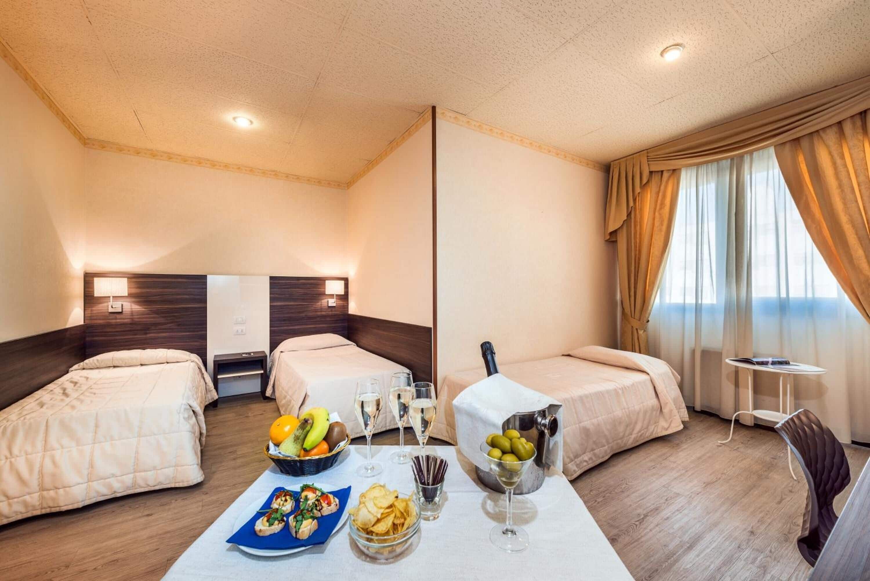 superior triple room | 1 bedroom, down duvets, pillow-top beds, minibar