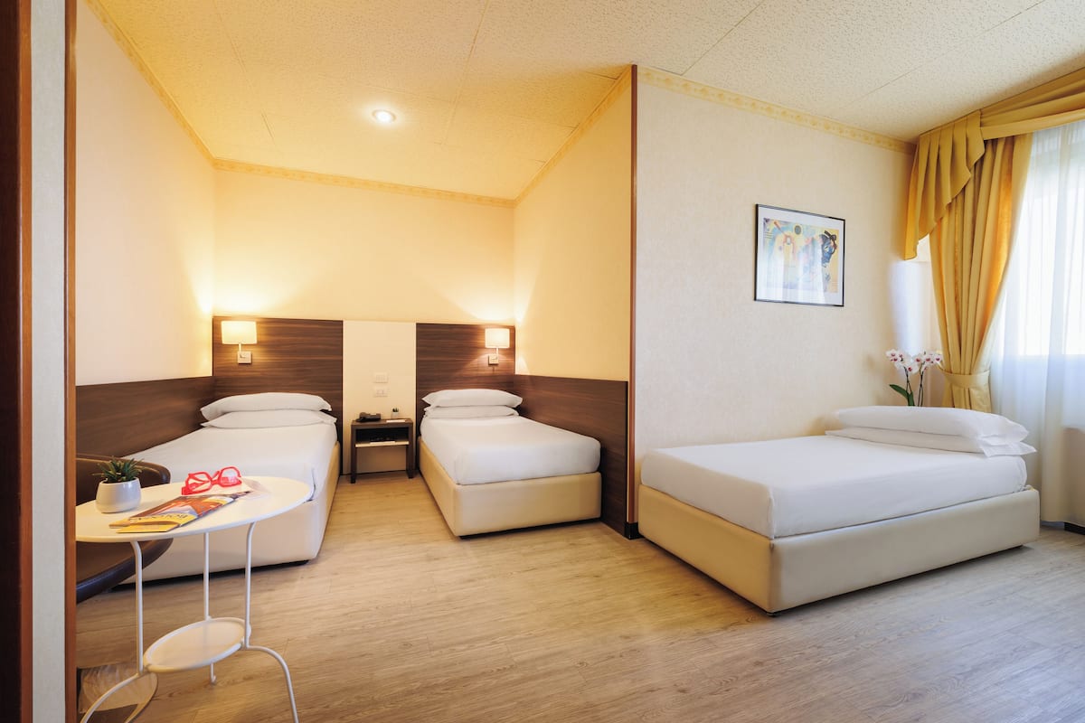 Superior Triple Room | 1 bedroom, down comforters, pillowtop beds, minibar