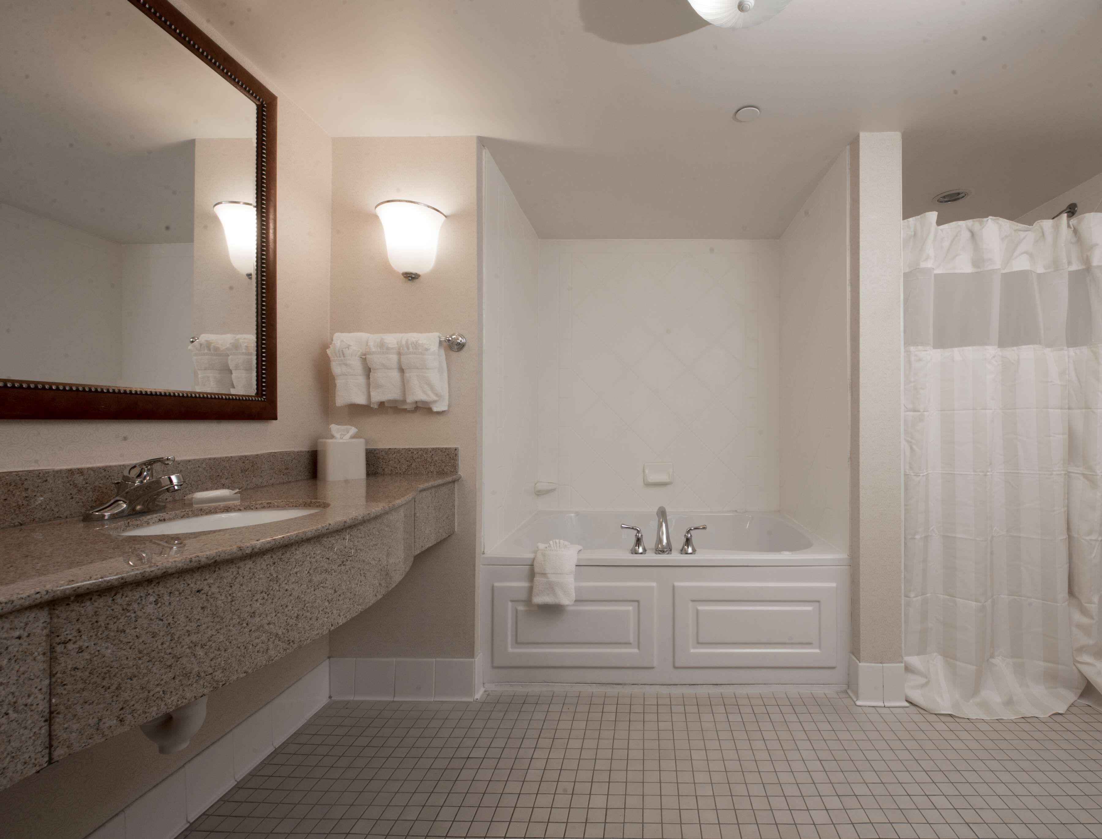 suite, 1 king bed | bathroom | free toiletries, hair dryer, towels, soap