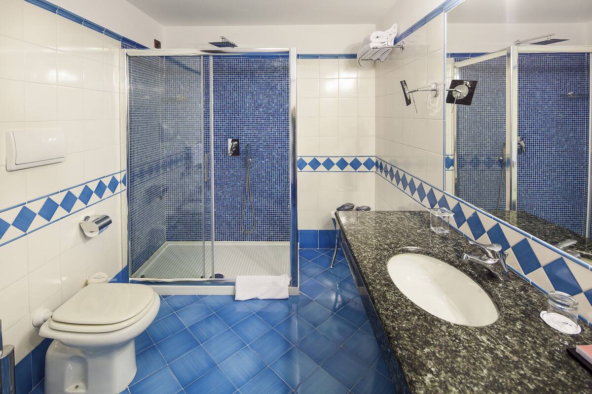 rainfall showerhead, designer toiletries, hair dryer, bathrobes