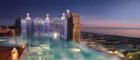 Outdoor pool, open 8:30 AM to 7:00 PM, pool loungers