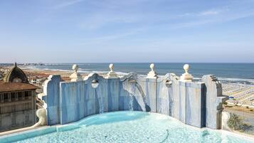 Outdoor pool, open 8:30 AM to 7:00 PM, pool loungers