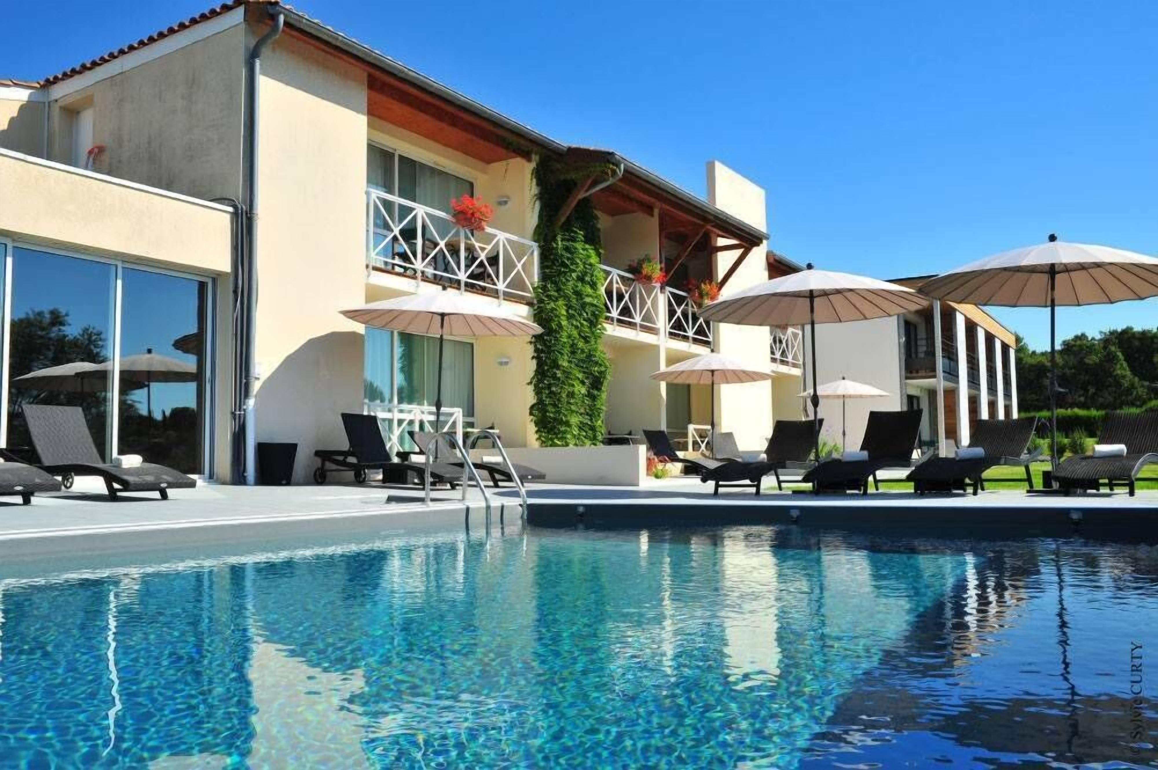 outdoor pool, open 8:00 am to 10:00 pm, pool umbrellas, pool loungers