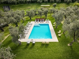 Seasonal outdoor pool, pool loungers