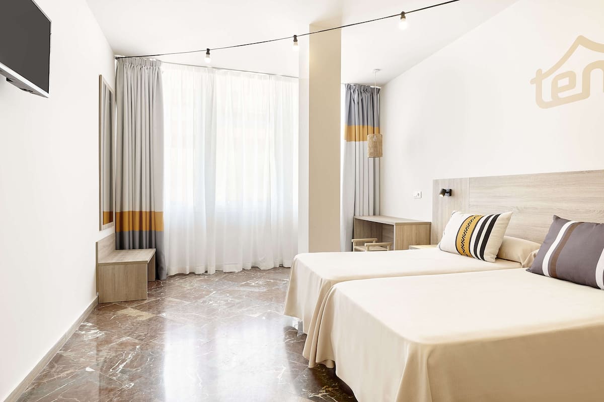 Laptop workspace, blackout drapes, iron/ironing board