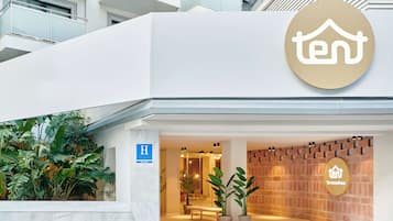 Welcome to Ten Torremolinos, where a modern exterior and lush surroundings create a warm and inviting atmosphere.