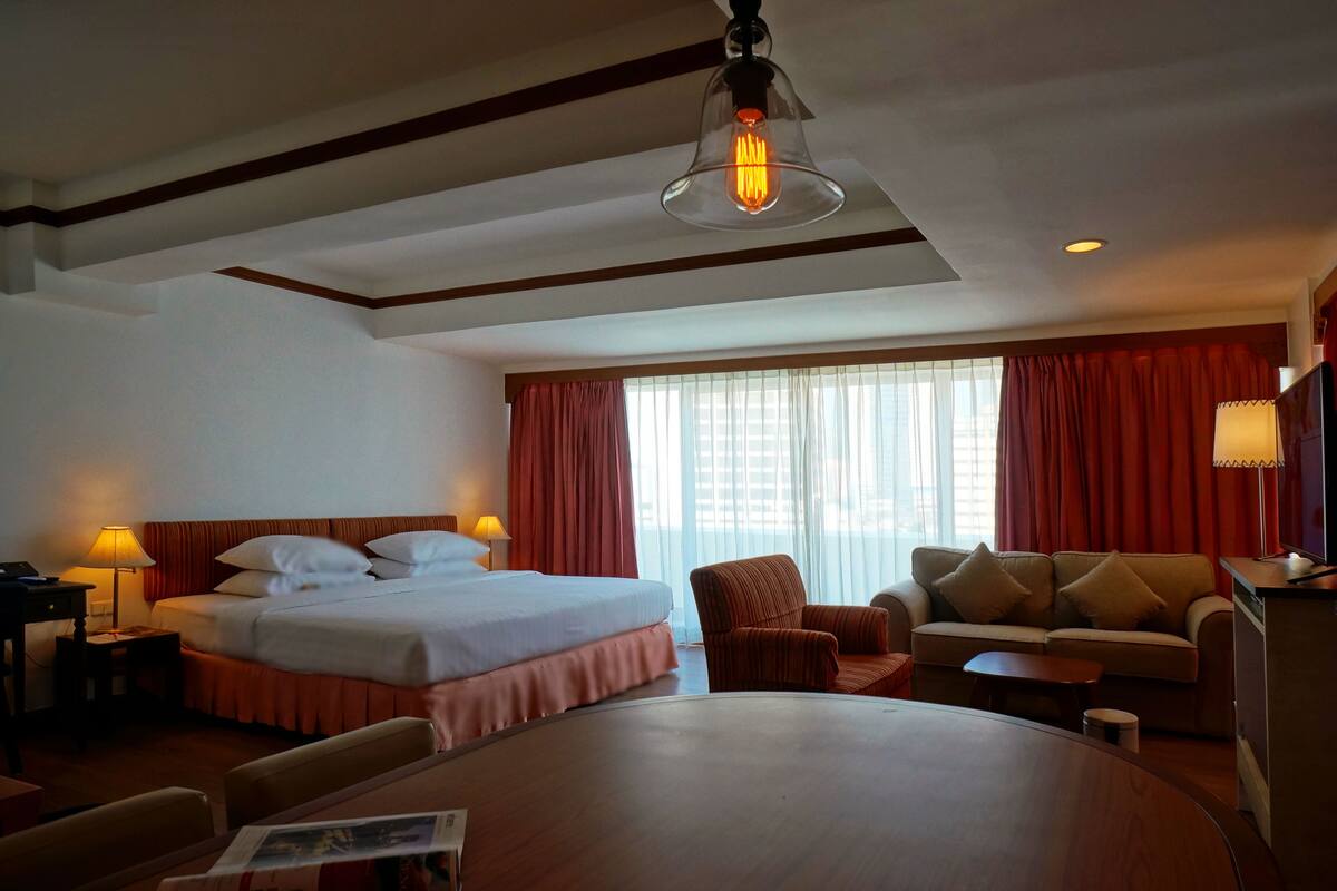 Corner Executive Suite with Balcony | Living area | LCD TV