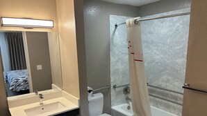 A bathroom with a sink, toilet, and bathtub. - Red Roof Inn Wildwood, FL - The Villages (Wildwood)