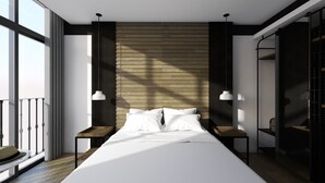 Una habitación de hotel moderna con una cama grande, dos mesitas de noche, un armario y un balcón.