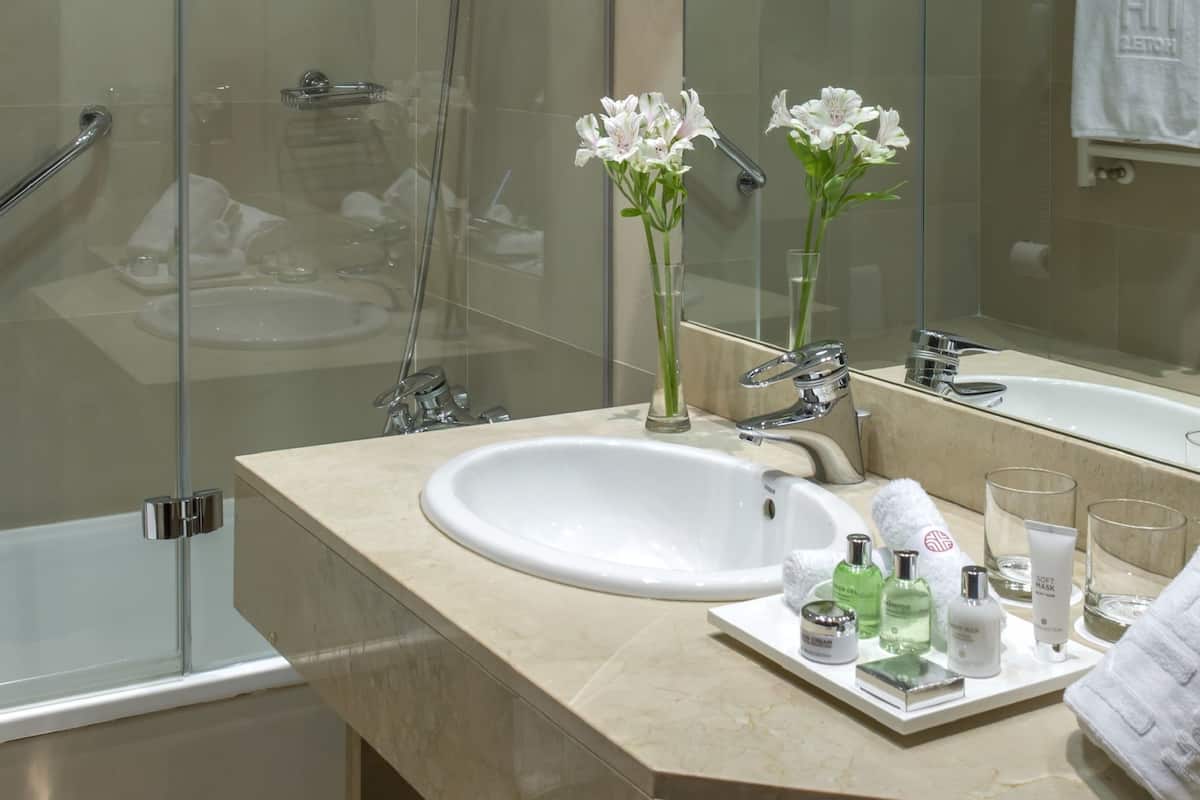 deep-soaking bathtub, rainfall showerhead, eco-friendly toiletries