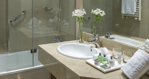 Deep-soaking bathtub, rainfall showerhead, eco-friendly toiletries