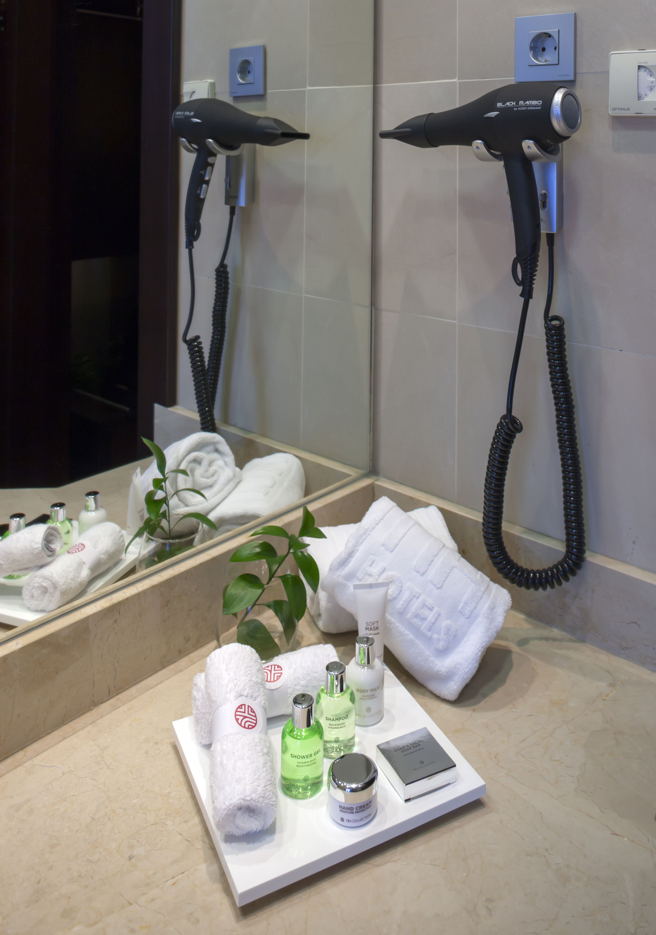 deep-soaking bathtub, rainfall showerhead, eco-friendly toiletries