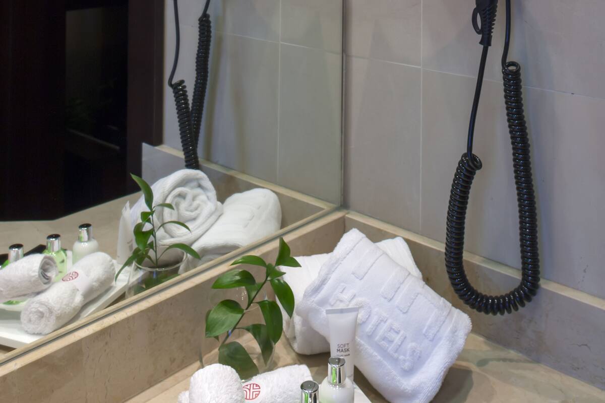 deep-soaking bathtub, rainfall showerhead, eco-friendly toiletries