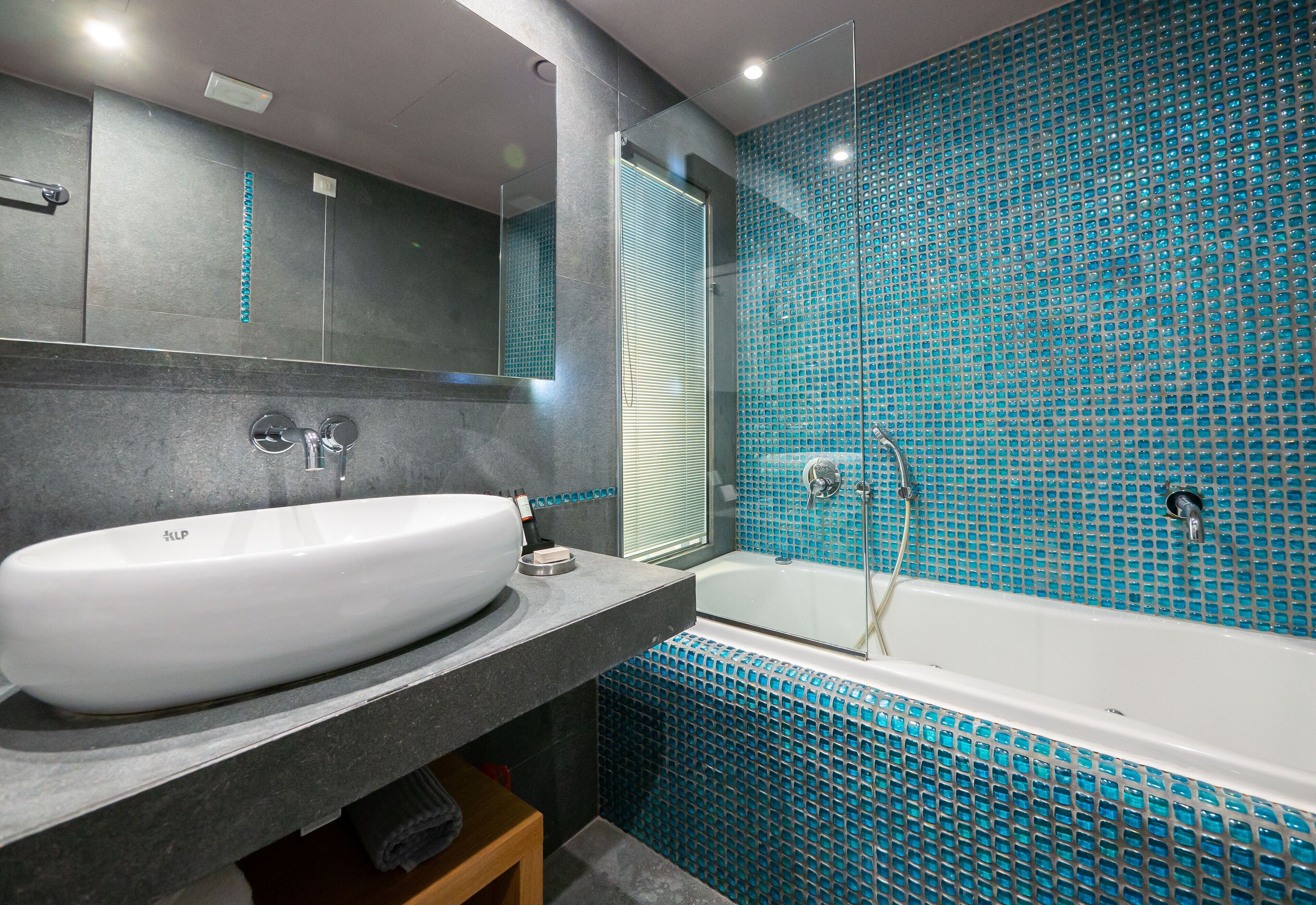 poseidon coco-mat suite front sea view | bathroom | shower, free toiletries, hair dryer, slippers
