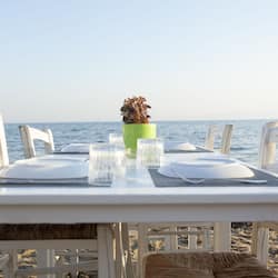 Breakfast, lunch, dinner served; beach views