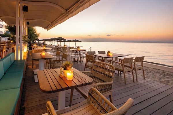 Breakfast, lunch, dinner served; beach views