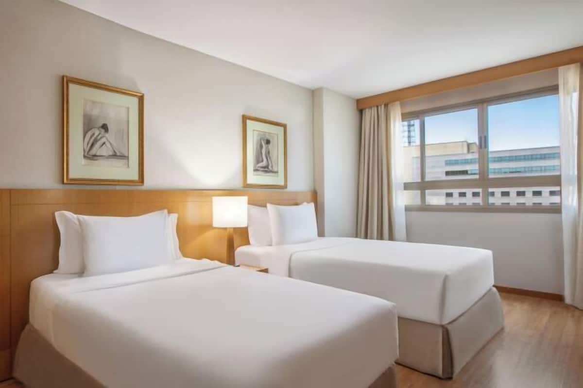 Hypoallergeen beddengoed, een minibar, een kluis op de kamer