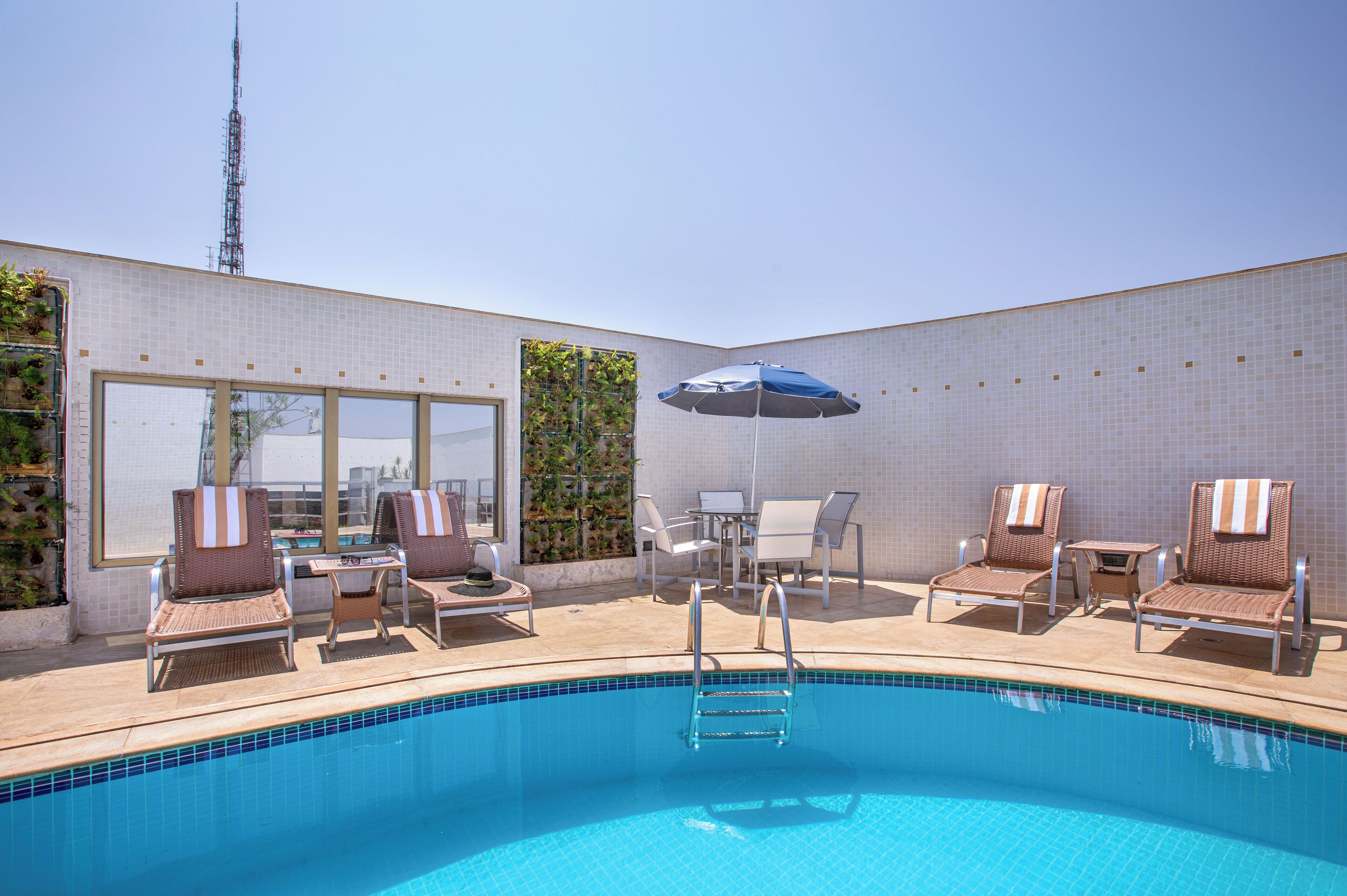 outdoor pool, open 7:00 am to 10:00 pm, pool umbrellas, pool loungers