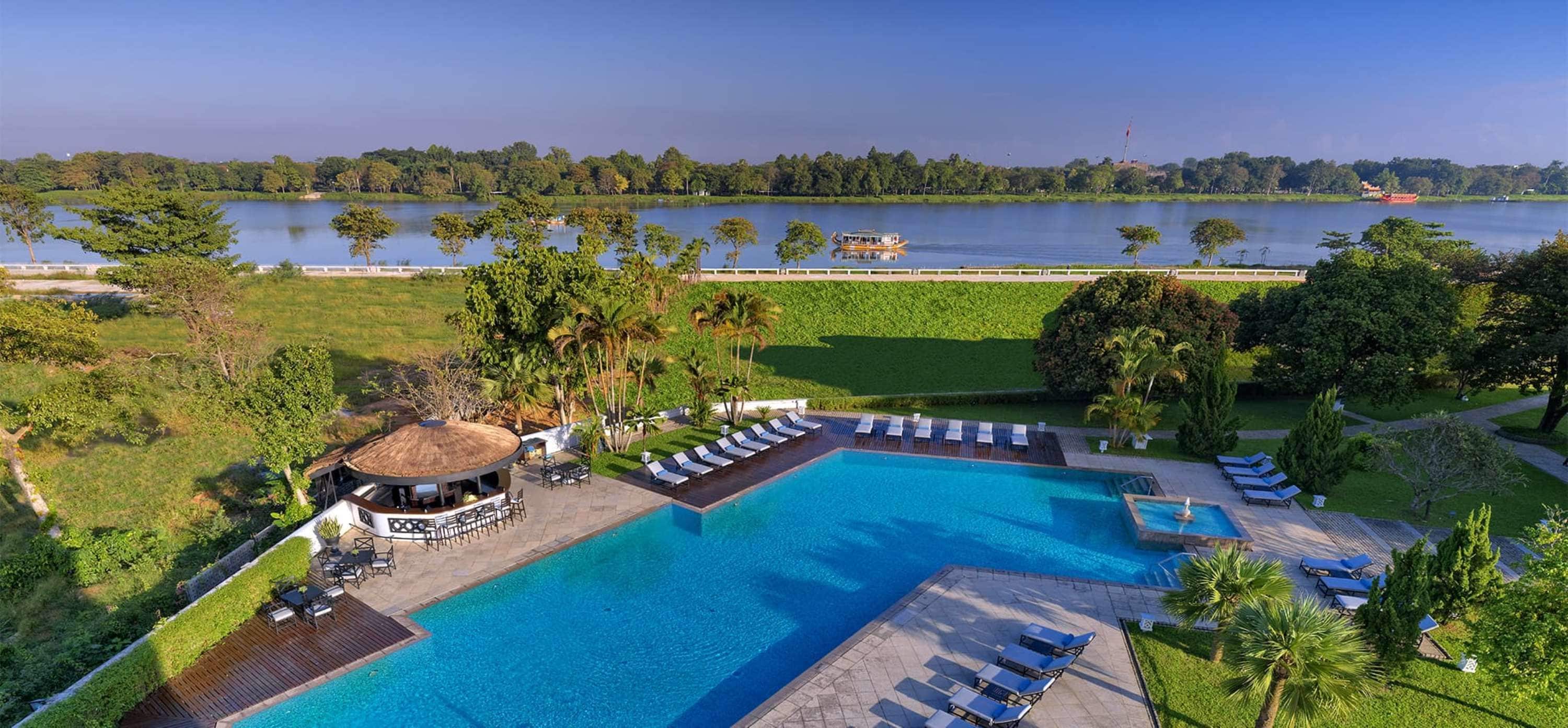 Outdoor pool, pool umbrellas, sun loungers