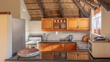 Cottage, 1 Bedroom | Private kitchen | Fridge, microwave, oven, stovetop