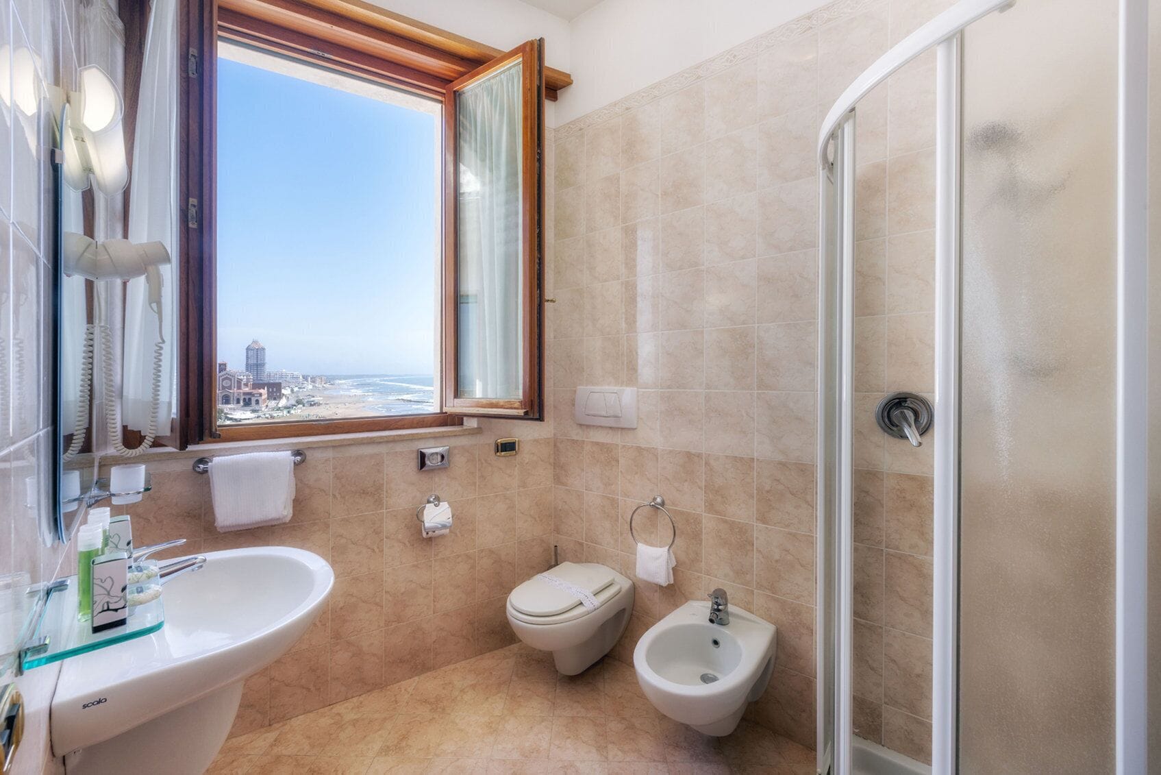 free toiletries, hair dryer, slippers, bidet