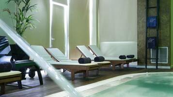 Indoor pool, outdoor pool, pool umbrellas, pool loungers