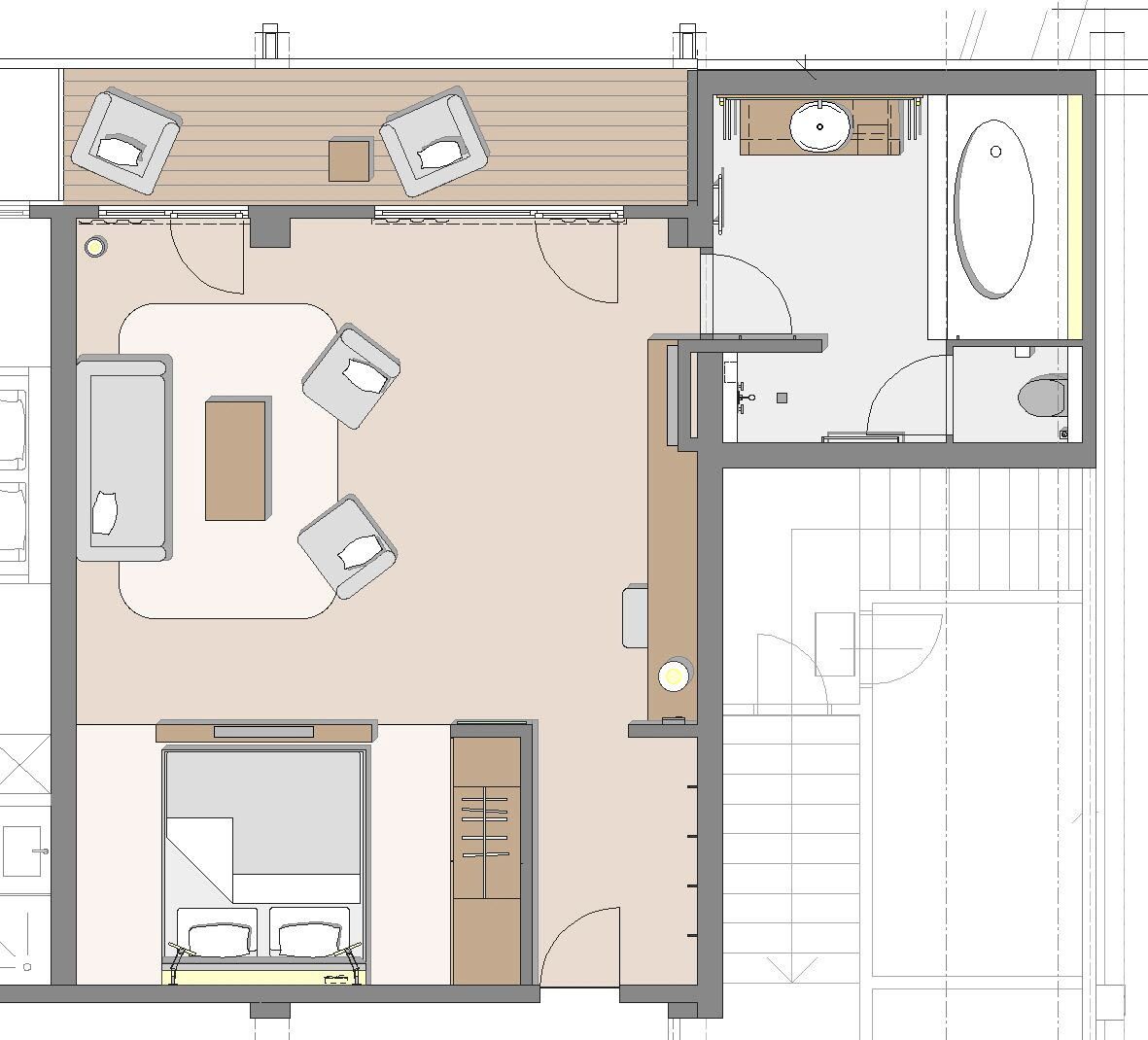 A floor plan of a hotel room with a bed, a desk, a chair, a small table, and a bathroom.