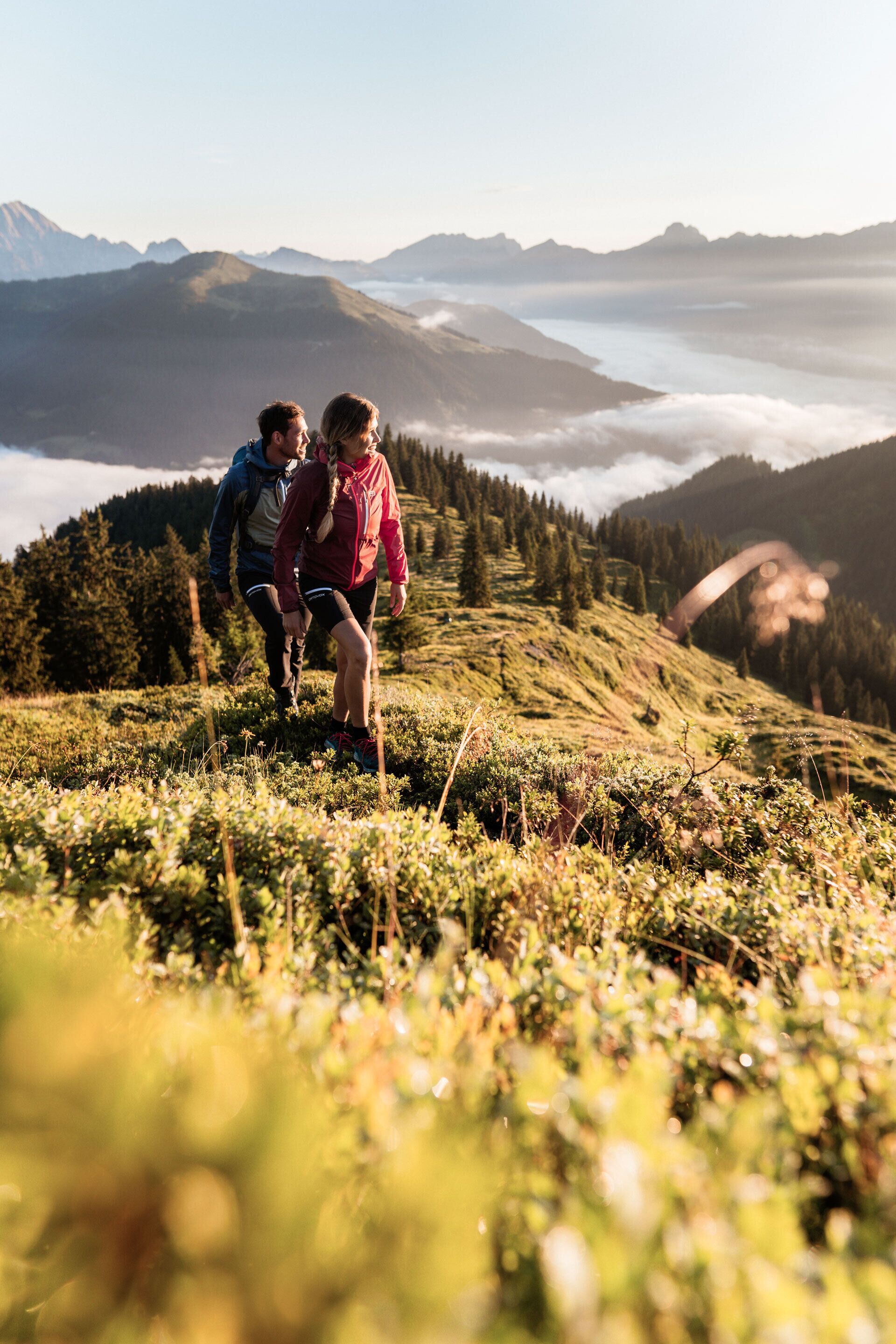 A mountainous landscape with hikers.