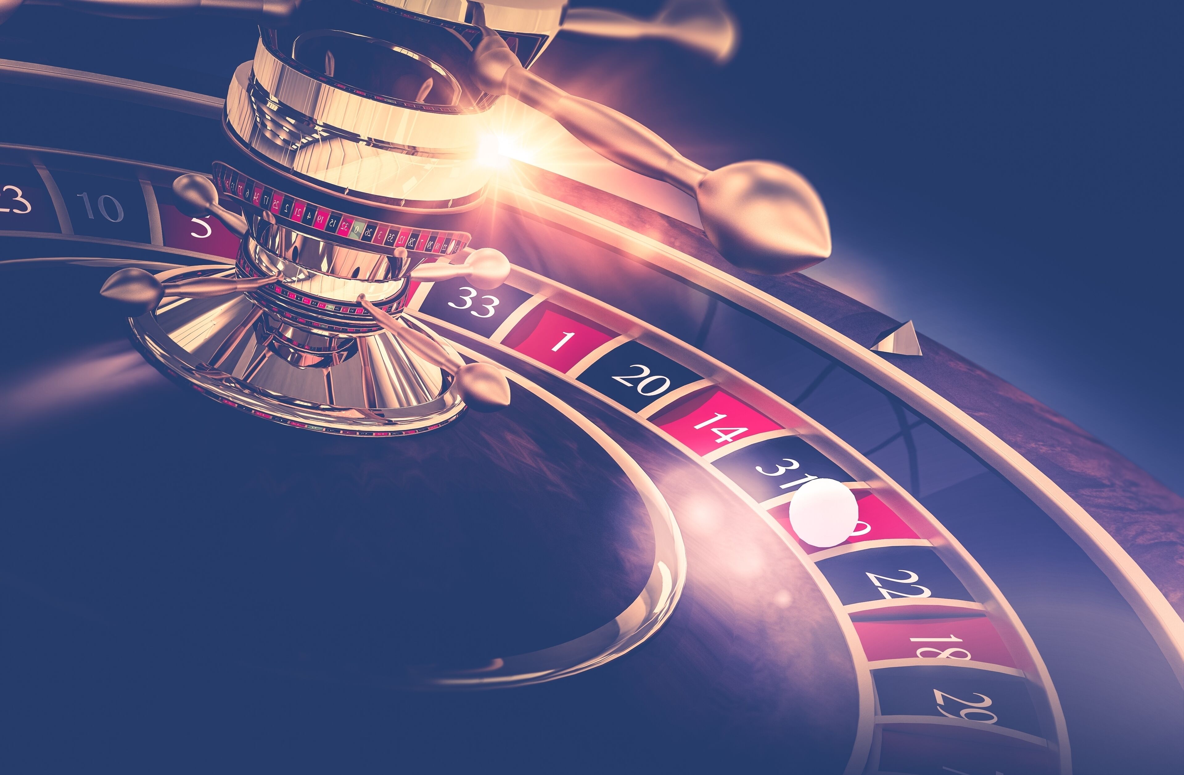 Une roulette comportant les numéros de 1 à 36 et le zéro (00), ainsi qu’une bille en mouvement.