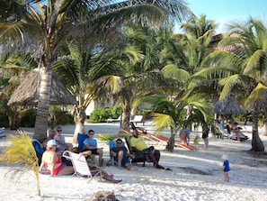 On the beach, white sand, free beach cabanas, beach umbrellas