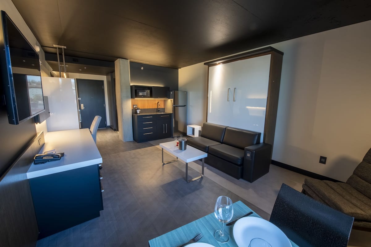 superior suite | living area | 55-inch flat-screen tv with cable channels, tv