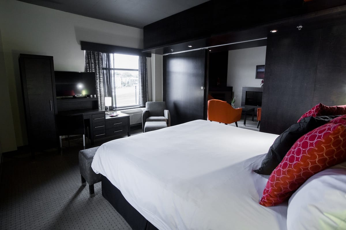 Premium bedding, desk, laptop workspace, blackout curtains