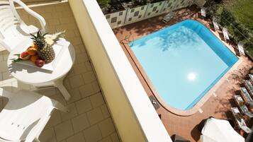 Seasonal outdoor pool, pool umbrellas, pool loungers