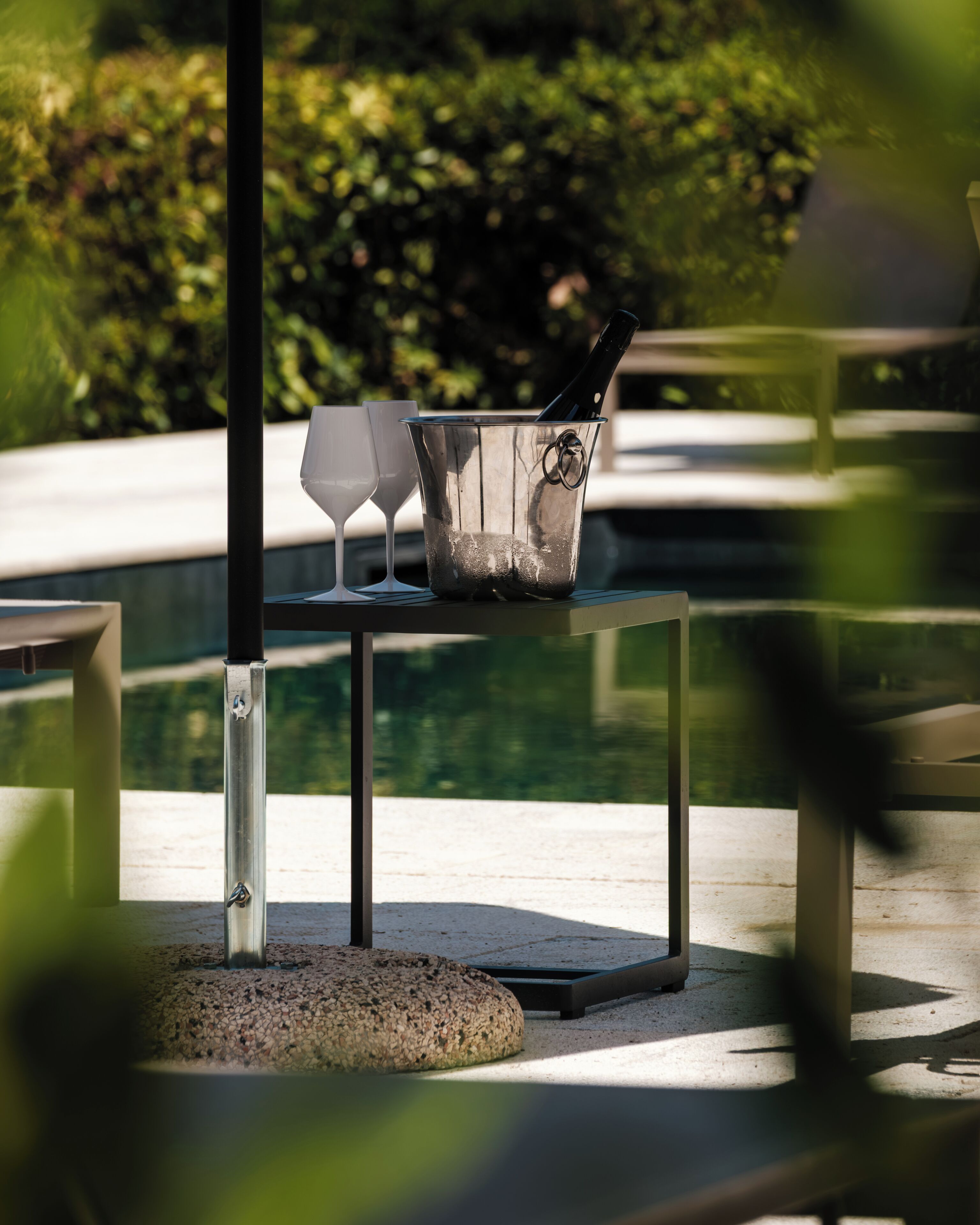 Seasonal outdoor pool, open 10:00 AM to 8:00 PM, pool umbrellas