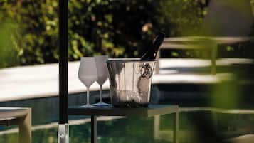 Seasonal outdoor pool, open 10:00 AM to 8:00 PM, pool umbrellas