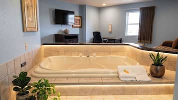 Executive Suite, 1 King Bed, Jetted Tub | Bathroom | Hair dryer, towels