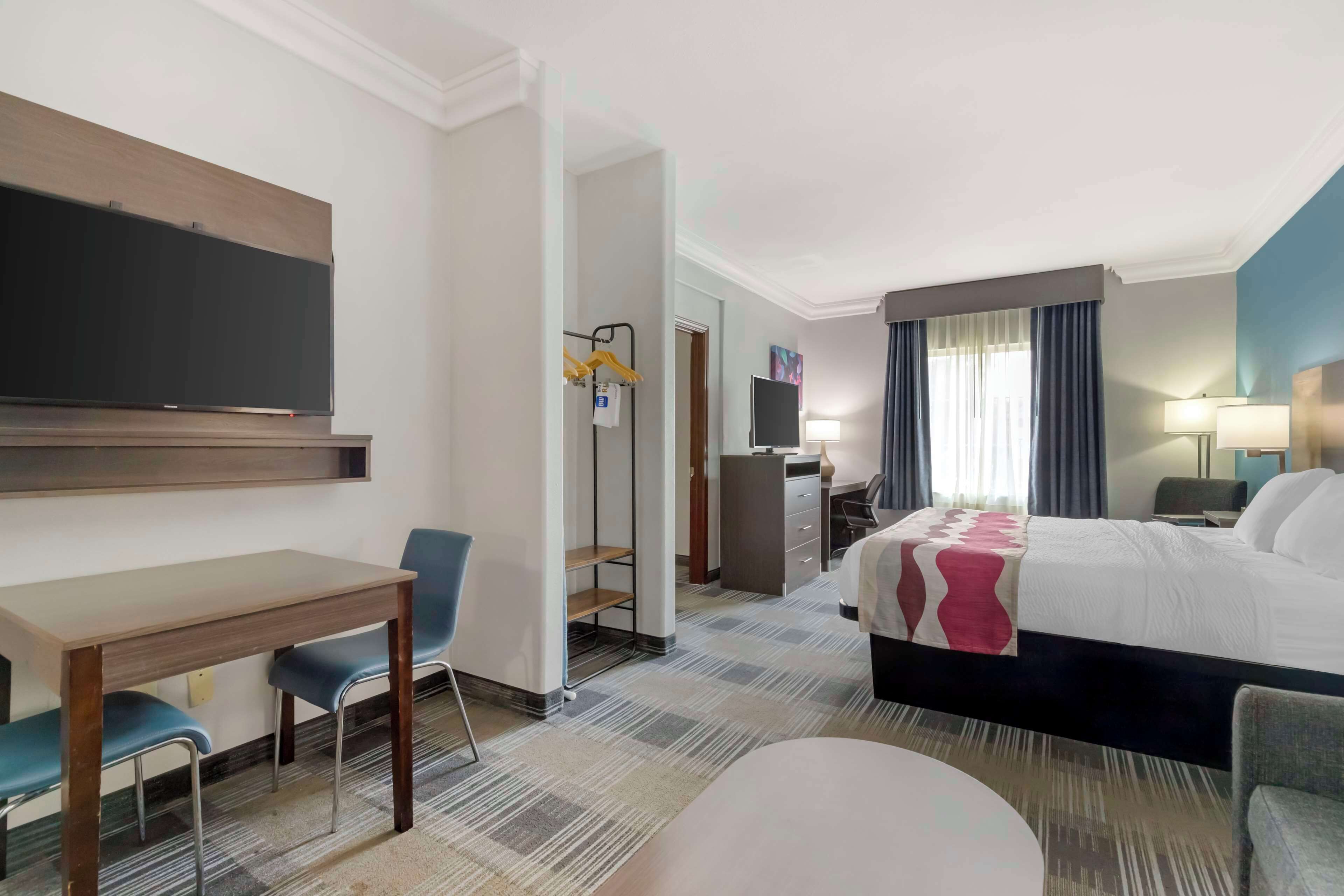 two bedroom suite, 1 king bed, 1 queen bed | iron/ironing board, free cots/infant beds, rollaway beds, free wifi