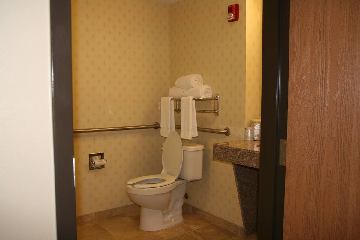 desk, laptop workspace, blackout curtains, iron/ironing board