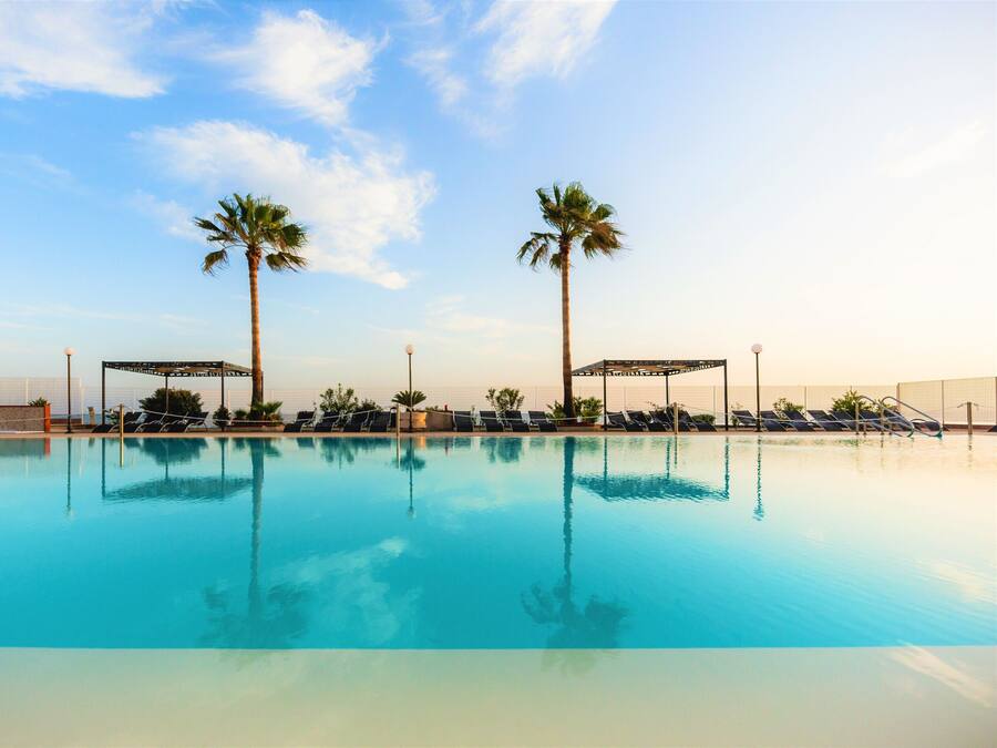 Outdoor pool, open 9:30 AM to 7:00 PM, sun loungers, lifeguards on site