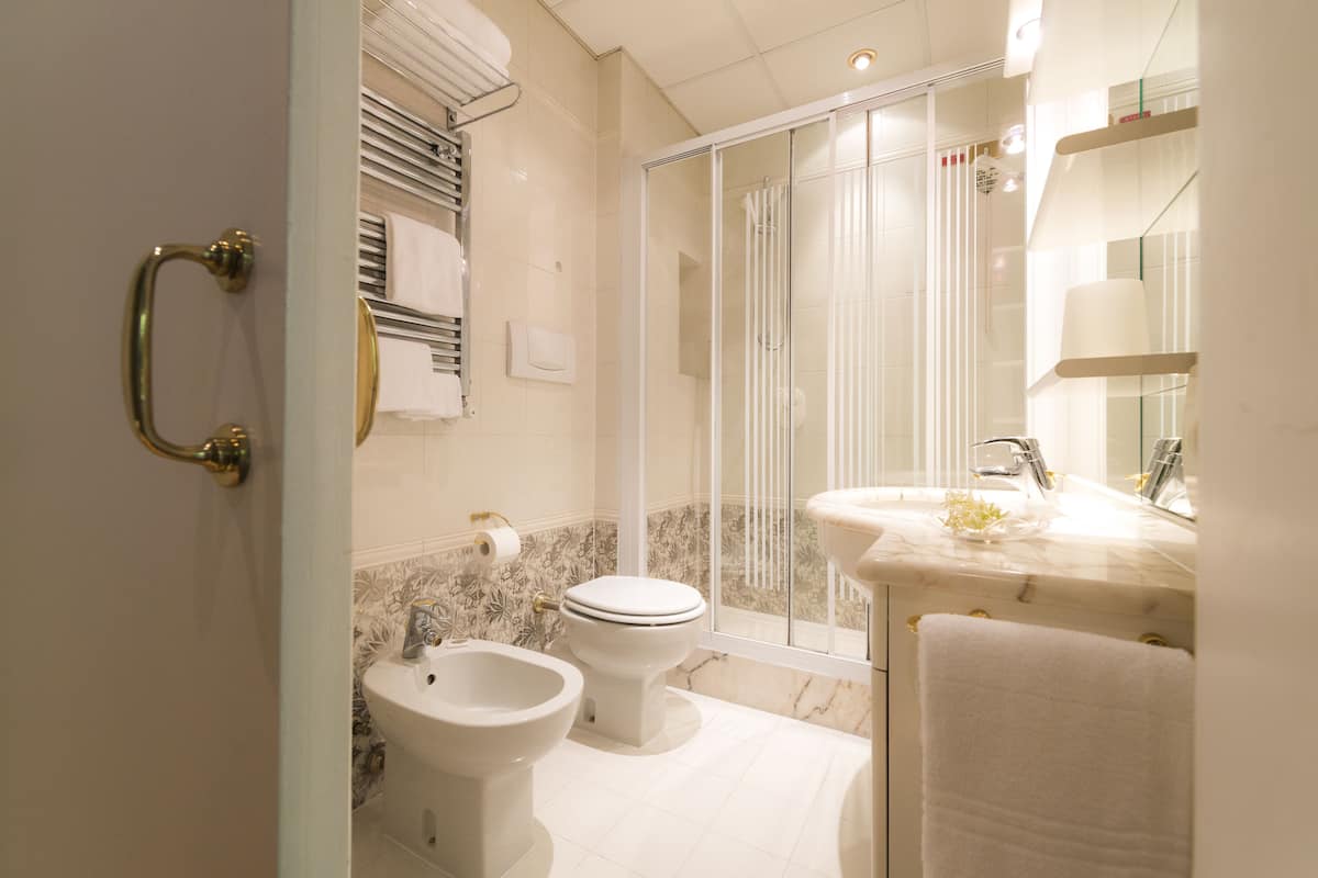 superior double room, garden area | bathroom | hair dryer, bidet, towels