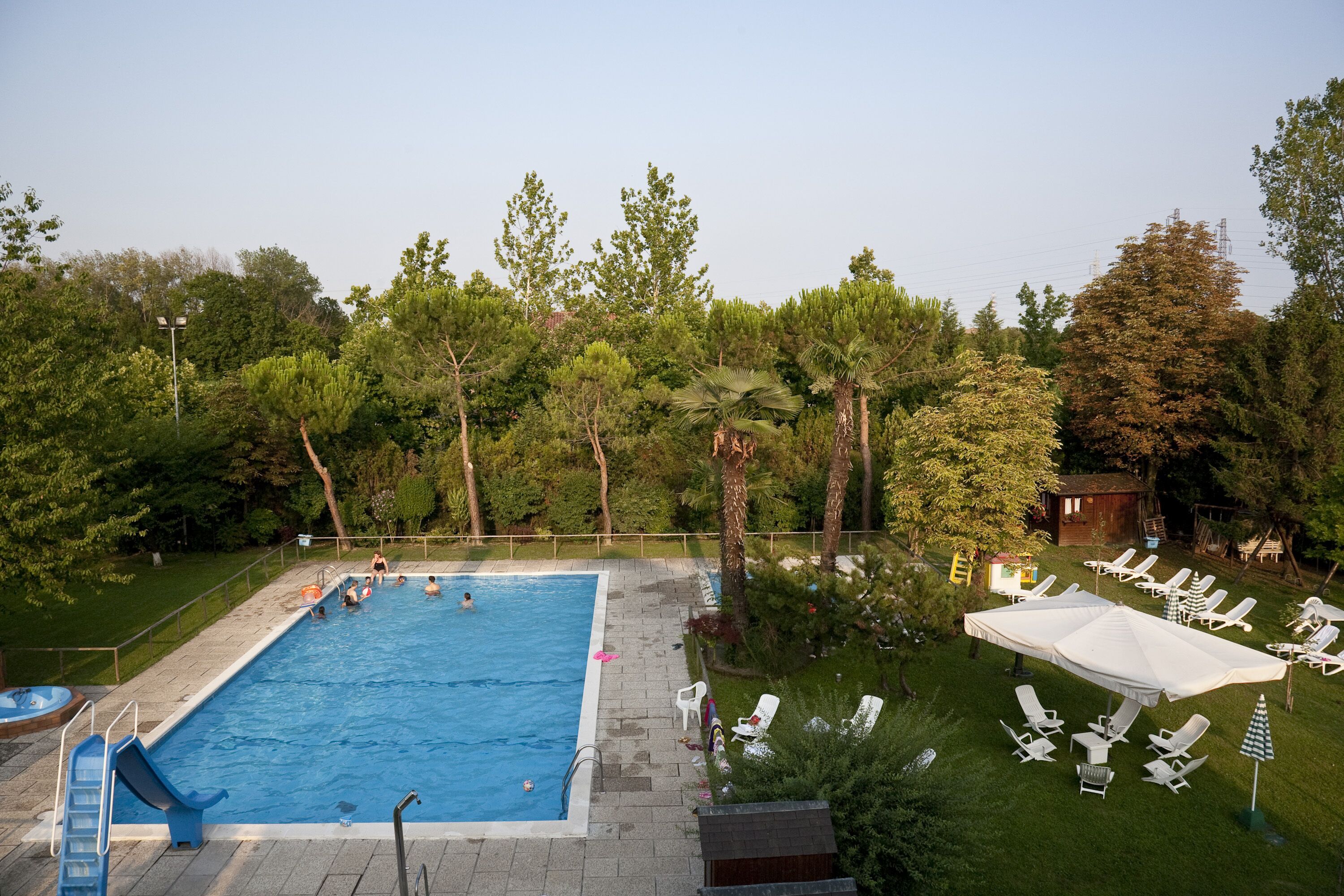 seasonal outdoor pool, open 10:00 am to 7:00 pm, pool umbrellas
