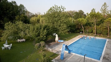 Seasonal outdoor pool, open 10:00 AM to 7:00 PM, pool umbrellas