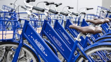 A row of blue bicycles with 'Copenhagen' branding, indicating a bike-sharing service.