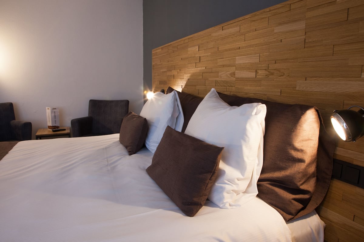 comfort room | desk, blackout curtains, iron/ironing board, cots/infant beds