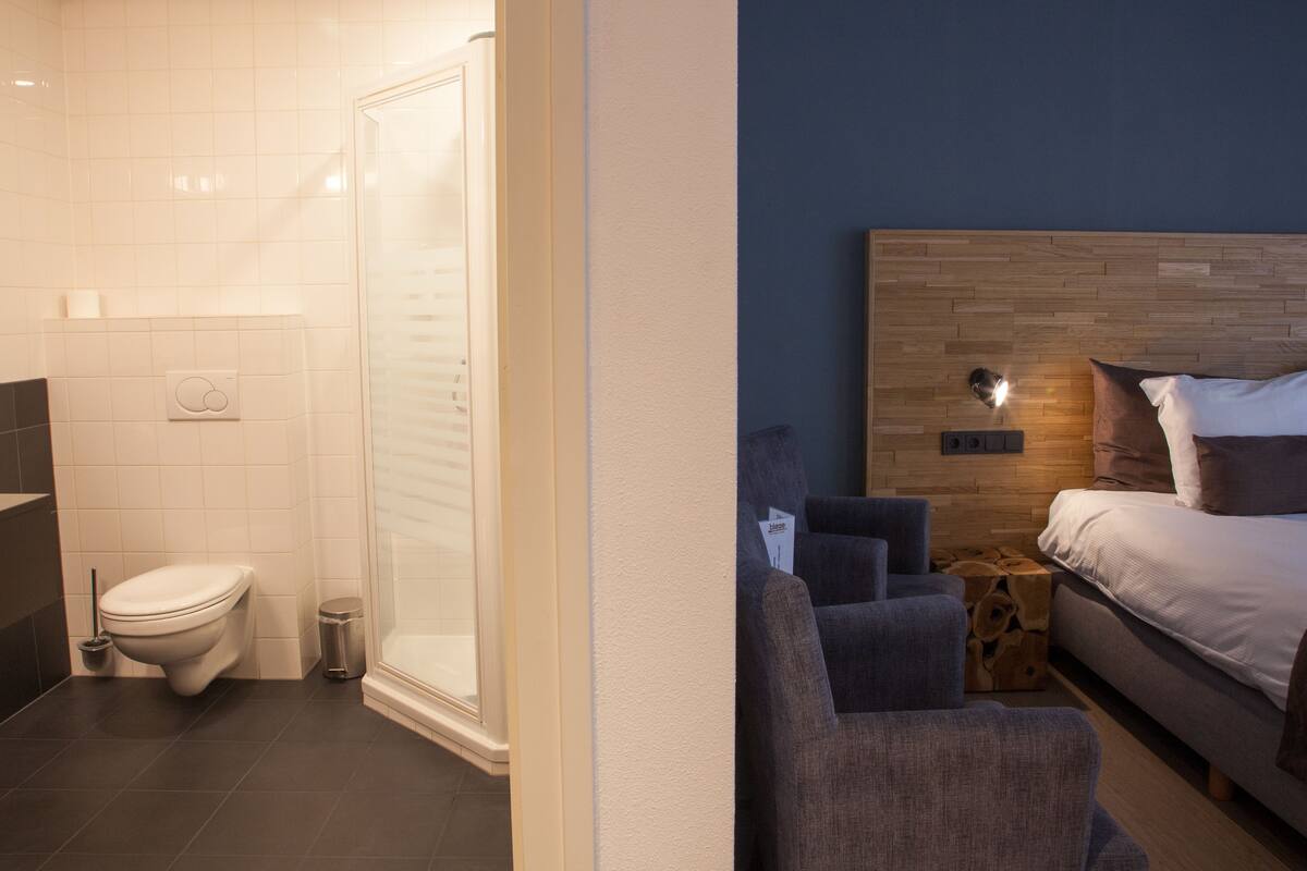 comfort room | desk, blackout curtains, iron/ironing board, cots/infant beds