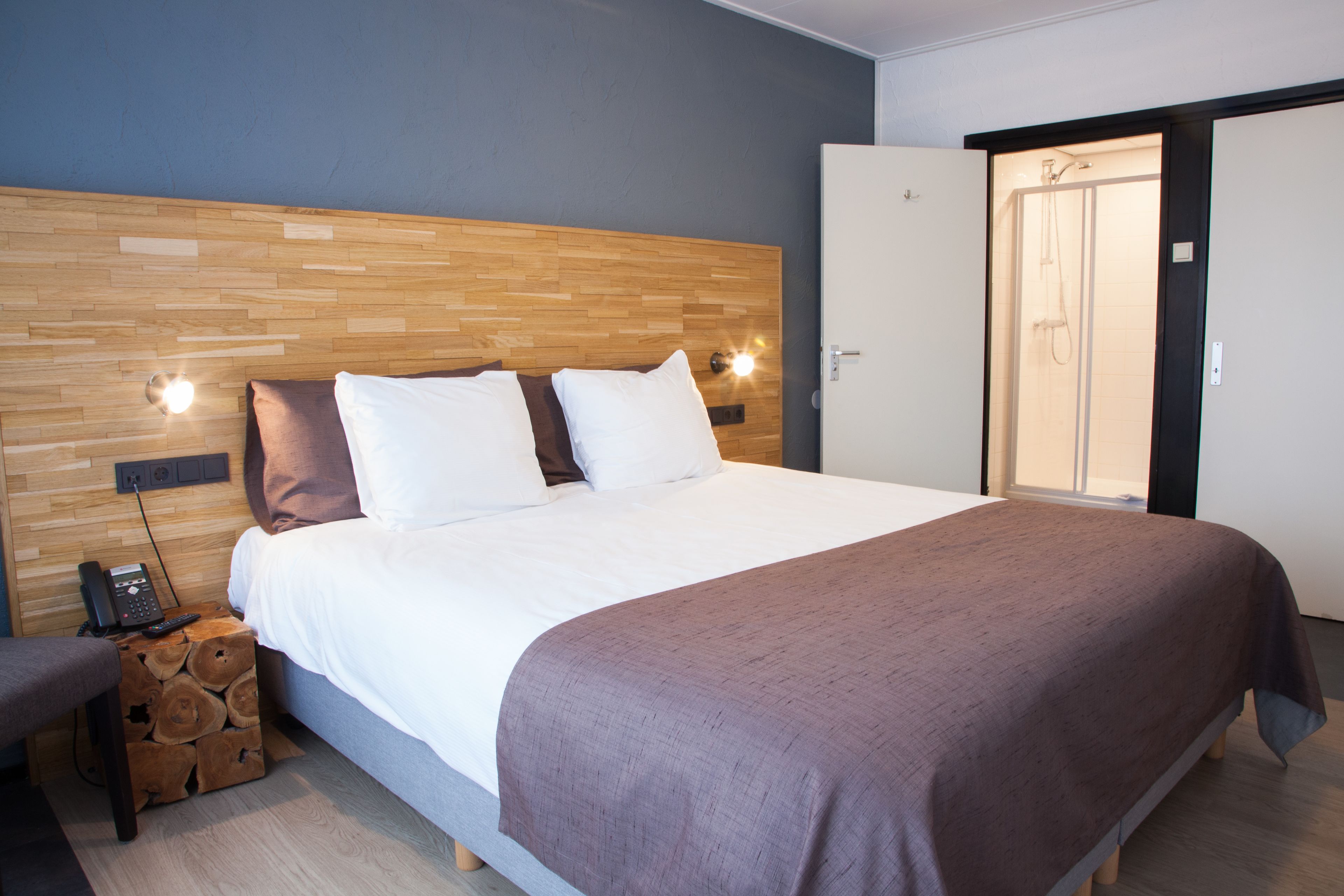 family room | desk, blackout curtains, iron/ironing board, cots/infant beds