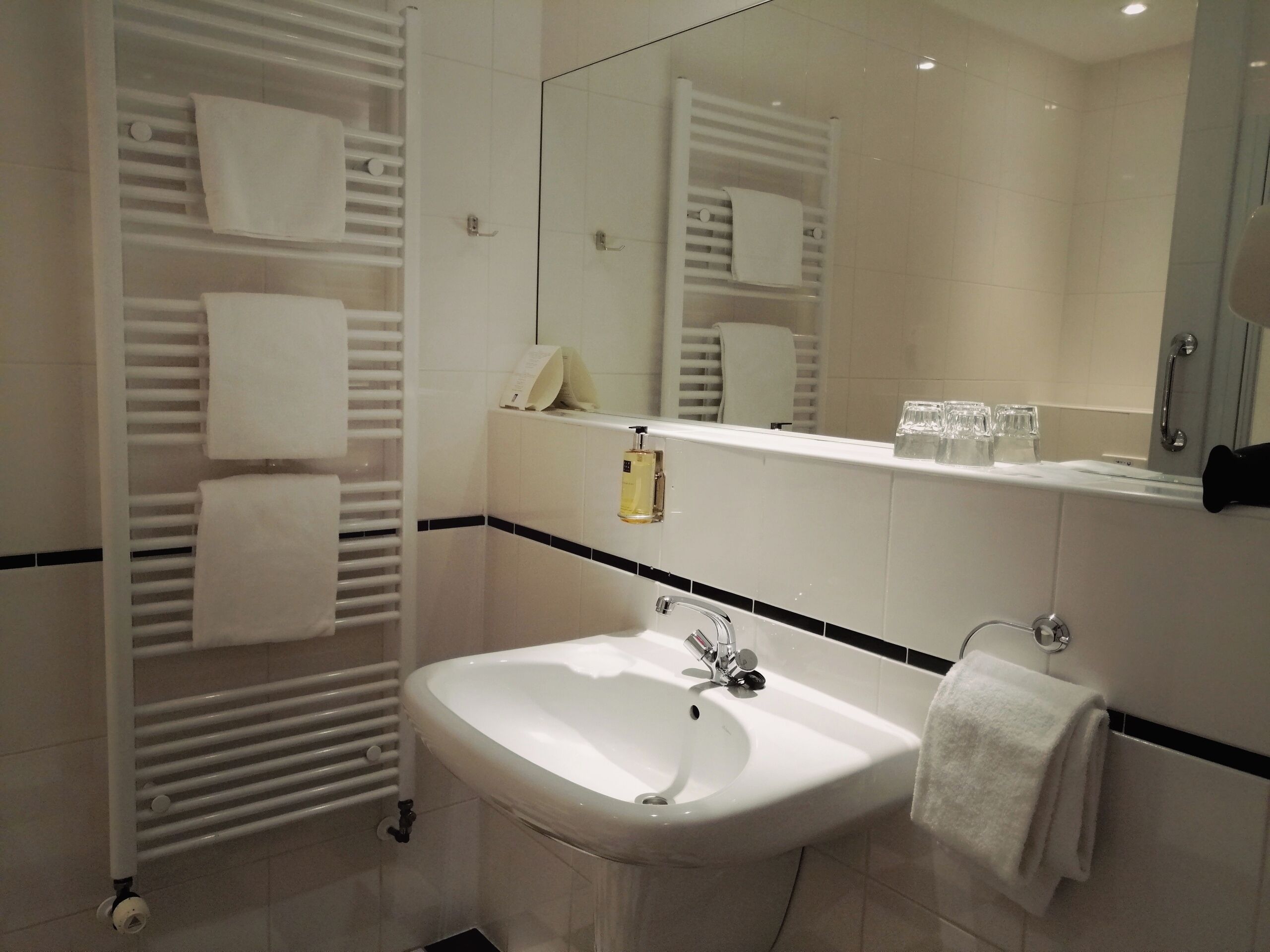 designer toiletries, hair dryer, towels